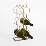 Kovový stojan na víno v zlatej farbe