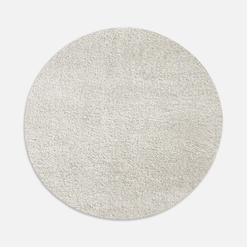 Dywan okrągły kremowy FURRY 60 cm wykonany z przędzy polipropylenowej.