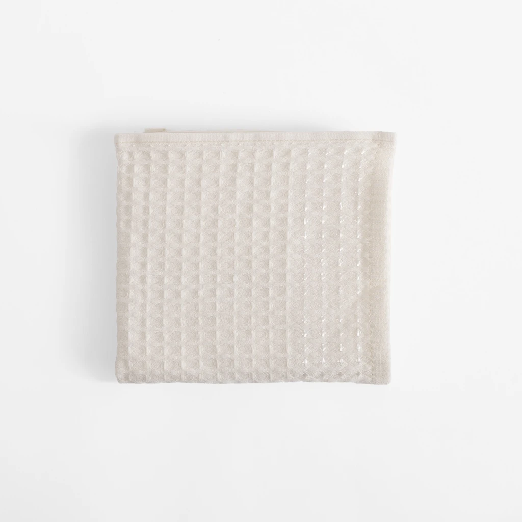 Kremowy bawełniany ręcznik o fakturze waflowej