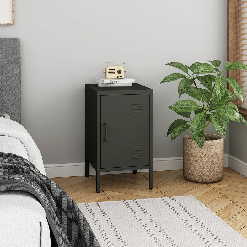 Czarna, metalowa szafka nocna na wysokich nóżkach.