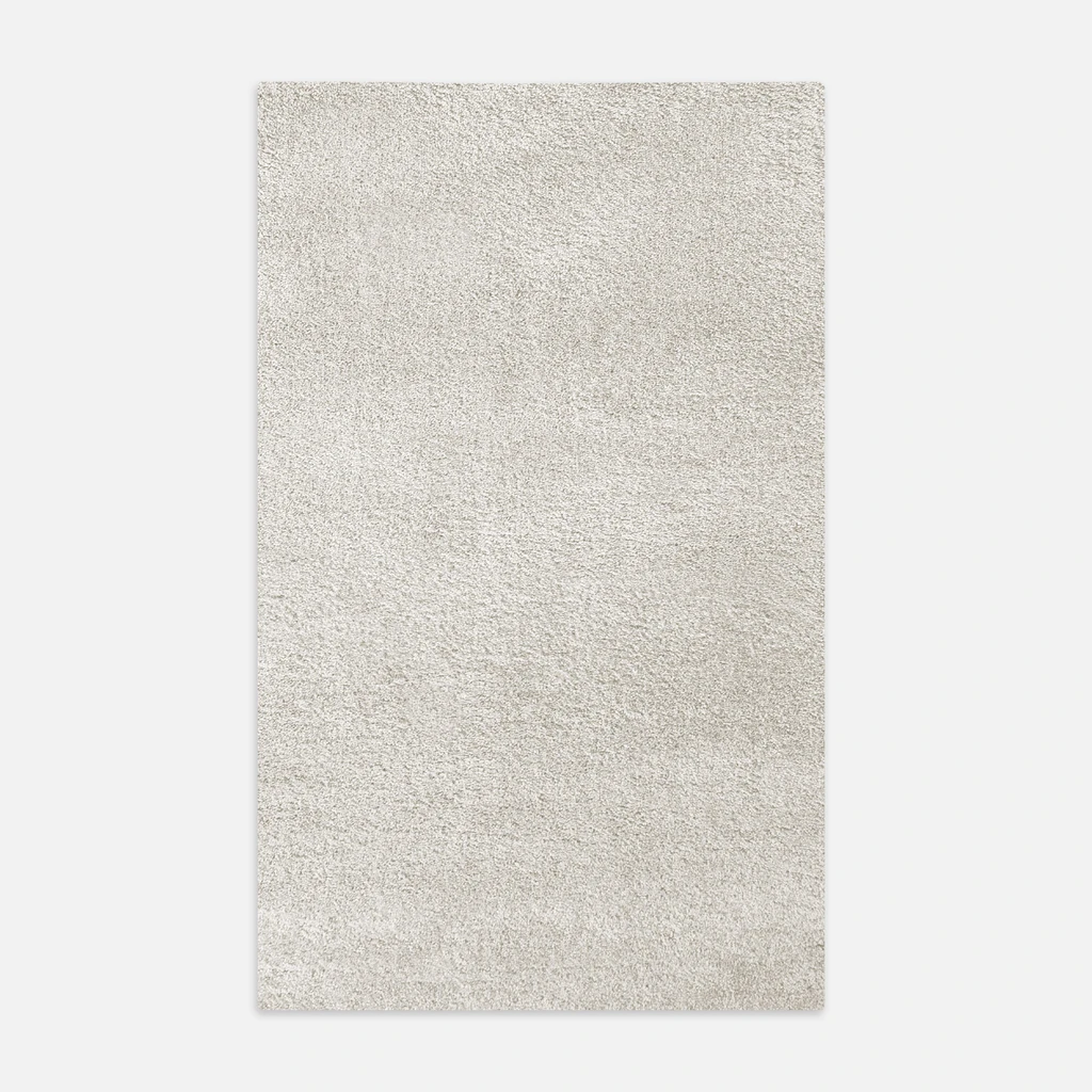 Dywanik kremowy FURRY 60x100 cm wykonany z przędzy polipropylenowej.