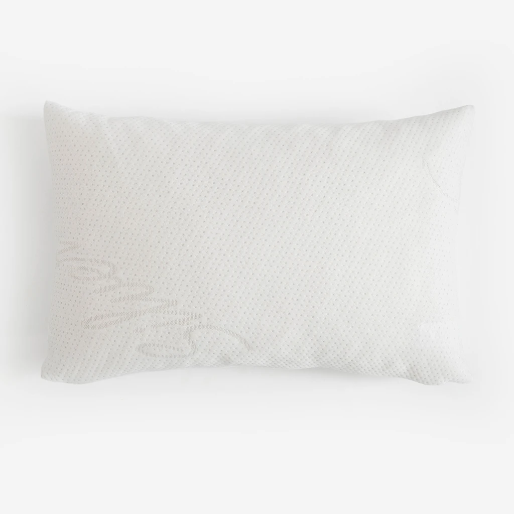 Biała prostokątna poduszka o pikowanej fakturze z jonami srebra.
