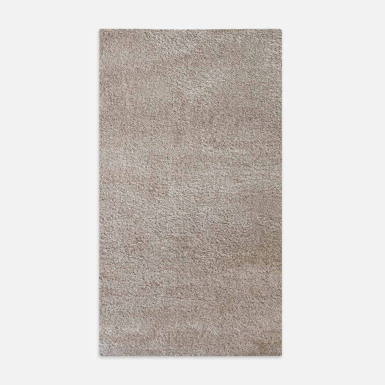 Dywan beżowy FURRY 80x140 cm wykonany z przędzy polipropylenowej.