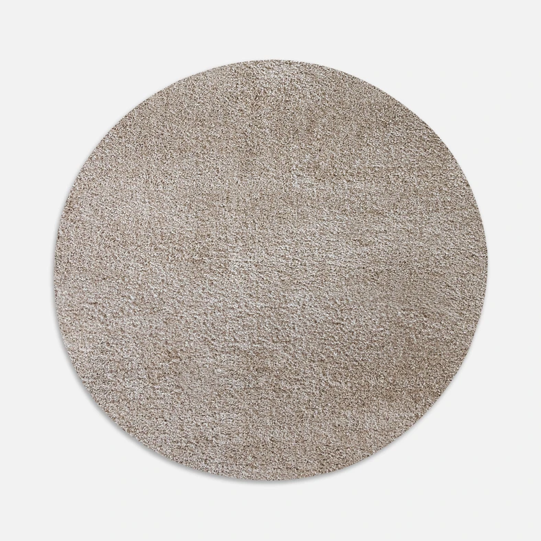 Dywan okrągły beżowy FURRY 60 cm wykonany z przędzy polipropylenowej.