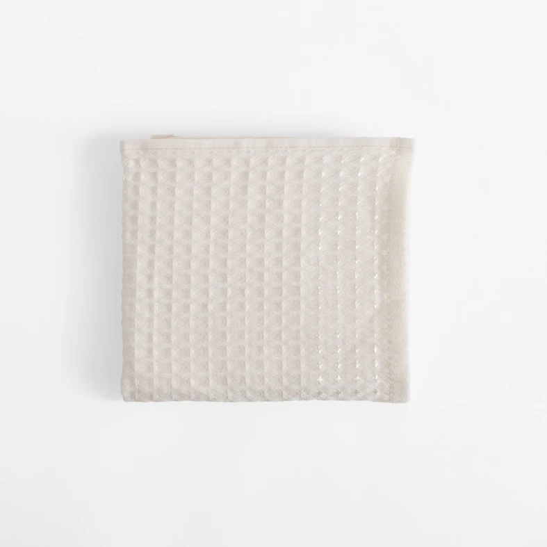 Kremowy bawełniany ręcznik o fakturze waflowej