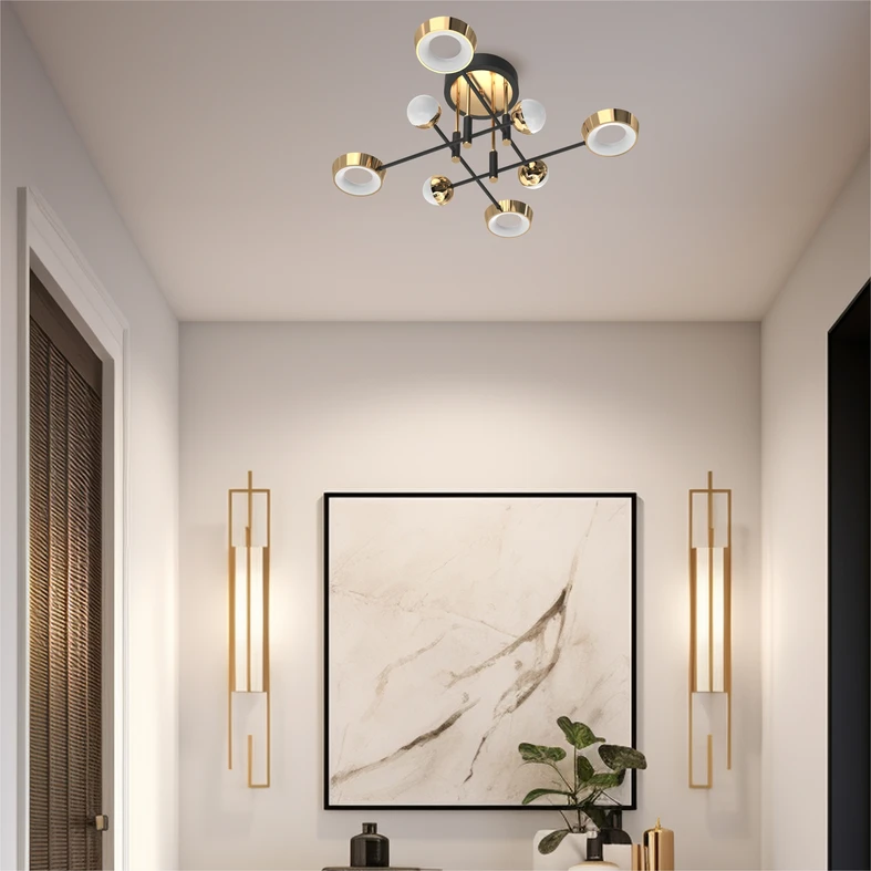 Wykończenie lampy LARA w złotym kolorze i czarnych, matowych akcentach nadaje wnętrzu szyku i świetnie współpracuje z ciepłym światłem LED-ów.