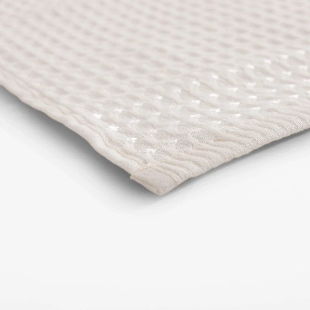 Kremowy bawełniany ręcznik o fakturze waflowej