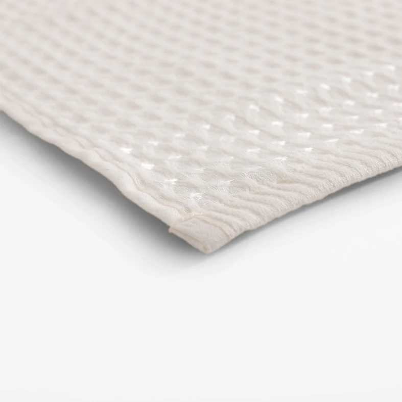 Kremowy bawełniany ręcznik o fakturze waflowej