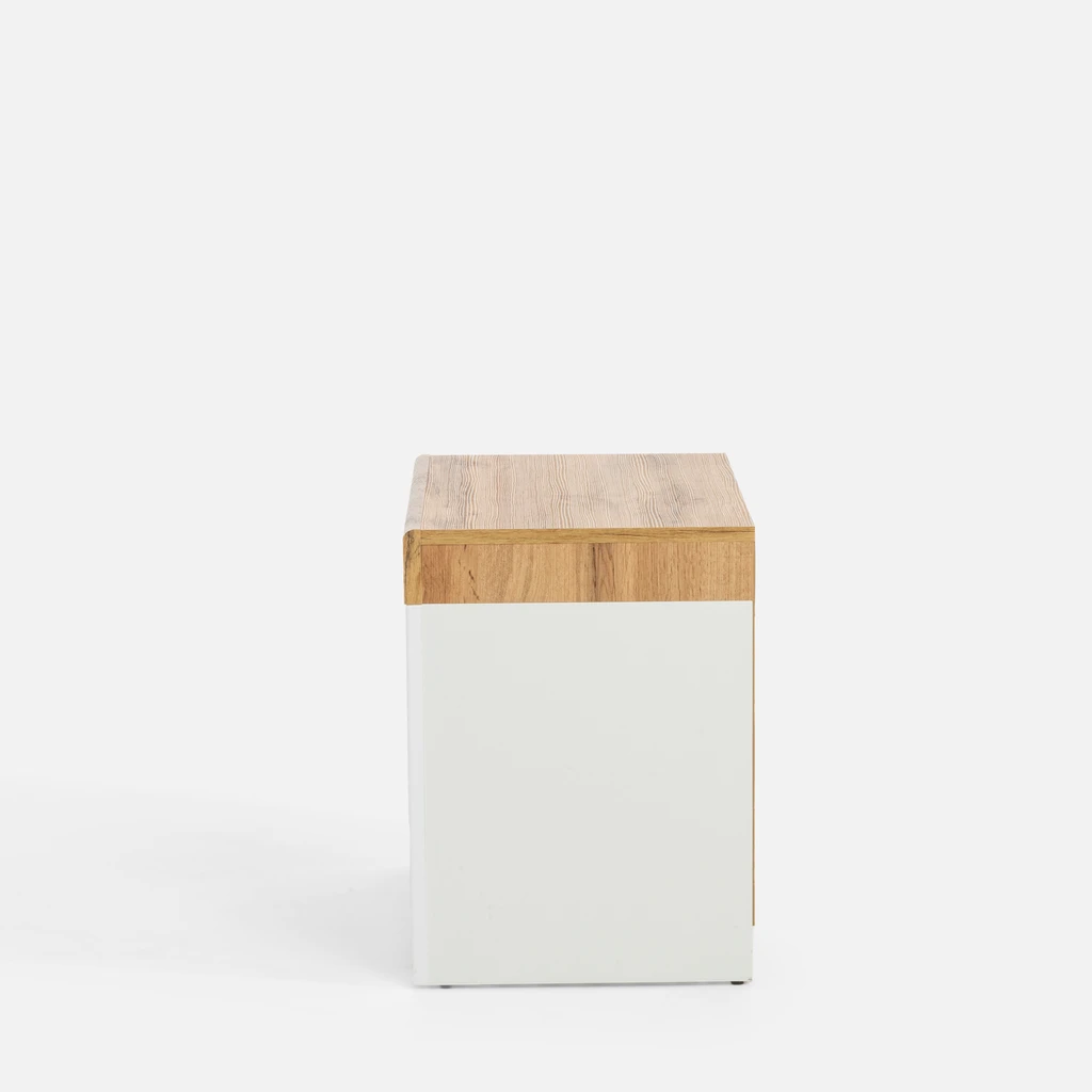 Biała szafka nocna z szufladą i otwartą półką.