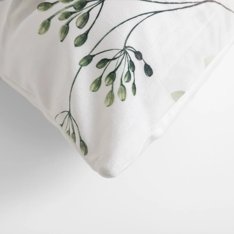 Welurowa biała poszewka w zielone liście